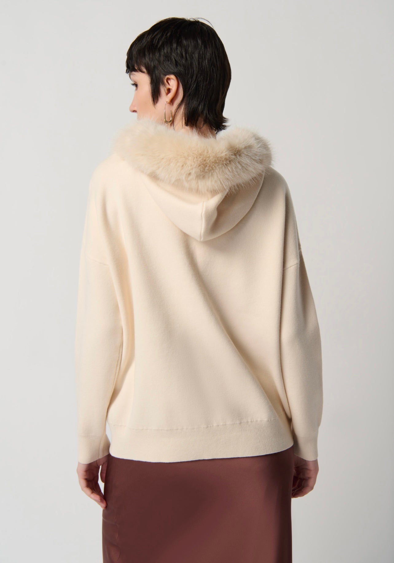Joseph Ribkoff Sweater with Faux Fur Hood and Pom Poms